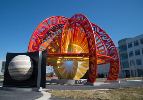 The cornerstone of the Visiting Our Solar System interactive exhibit in Discovery Park is the design of the sun, which is 45 feet in diameter. Surrounding the VOSS sun (pictured here) are the planets Mercury, Venus, Earth, Mars, Jupiter, Saturn, Uranus and Neptune set into a series of curved, 6-foot-high walls. Jeff Laramore and Tom Fansler of Smock Fansler Corp. of Indianapolis were the designers on the $1.5 million project.    (Mark Simons/ Purdue University)